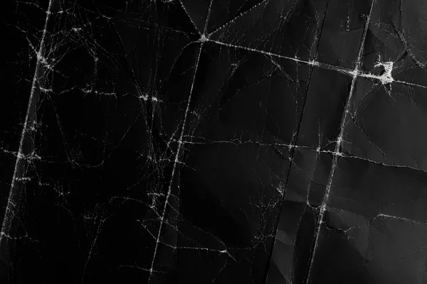 Siyah kağıt arka plan. Yaşlı ve buruşuk