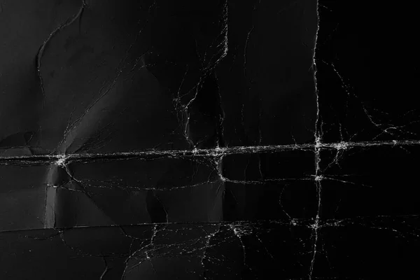 Katlanmış siyah buruşuk kağıt. Tozlu eski püskü kumaş.