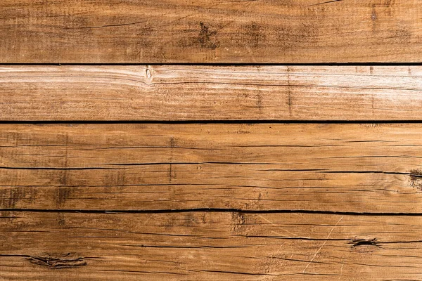 Çatlamış kahverengi ahşap doku. Eski tahta arka plan.