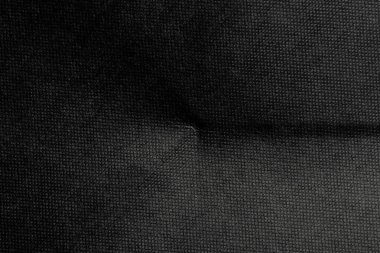 Eski, buruşuk, pürüzlü, karton bir çarşaf. Kağıt koyu soyut arkaplan