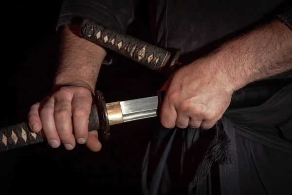 Samurai handle a japanese katana sword and a katana on a tatami — Stock Photo, Image