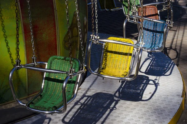 merry-go-round with colorful chairs