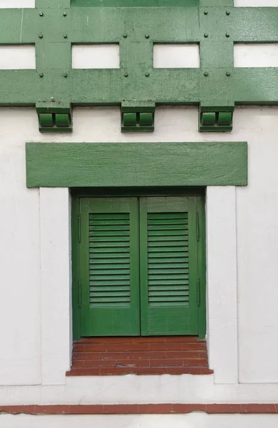 window with green shutters
