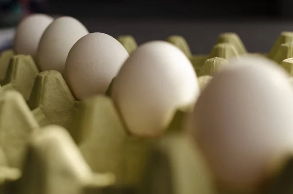 a pack of white farm eggs