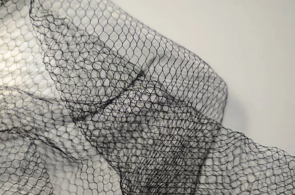 Transparent mesh fabric. Texture of fabric. Cloth-net