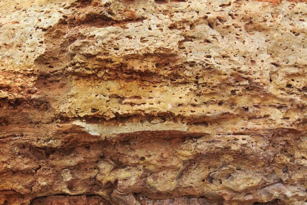 Камень, слои структуры, теплый коричневый, желтый, красный оттенки . — стоковое фото