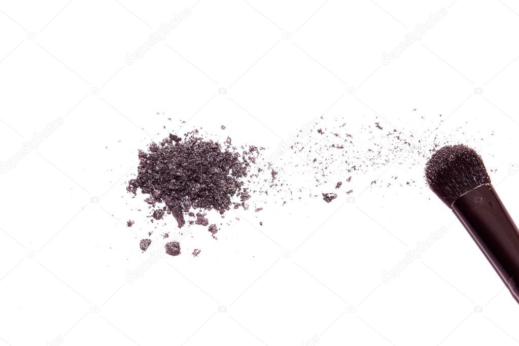 broken makeup eye shadow isolated on a white background