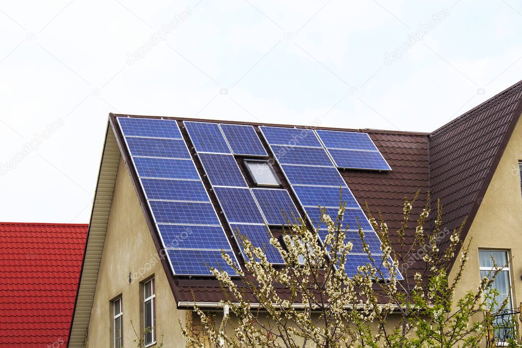 Solar panel on a roof of a house , concept of save resources