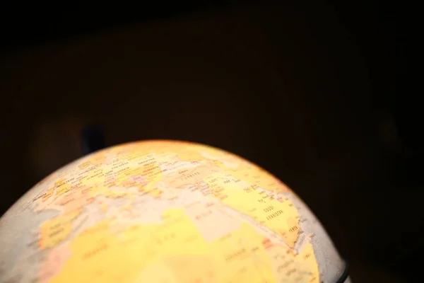 Illuminated Earth Globe Isolated on Black