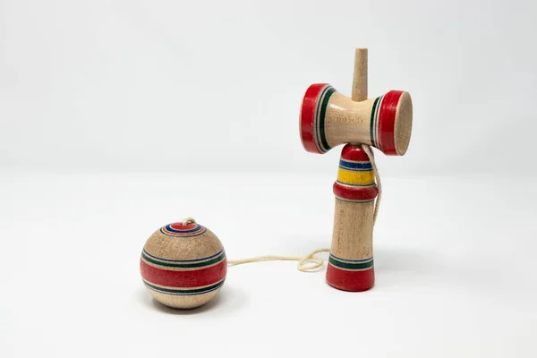 The original Kendama. An ancient, traditional, wooden Japanese skill toy for children. Has three cups and a spike which fits into the hole in the ball. Isolated on white background.