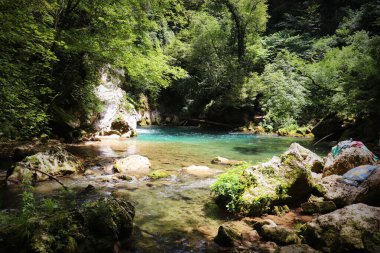 The waterfall of San Benedetto in Subiaco, Rome, Lazio, Italy. Rich vegetation in the woods. Cool place, refreshment from summer heat. Trekking, mountain excursion. Peace, silence, nature. clipart