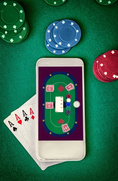 Online casino.Mobile casino. Smartphone with poker table on screen.