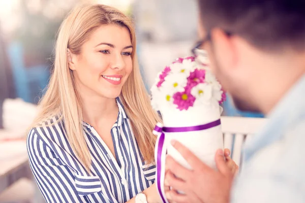 Romantic man gives a flower arrangement to his girlfriend, Valentine\'s day, birthday, anniversary
