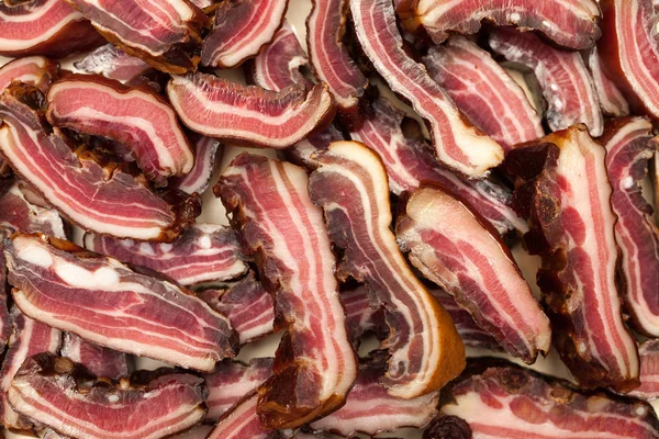 Rashers of bacon on plate