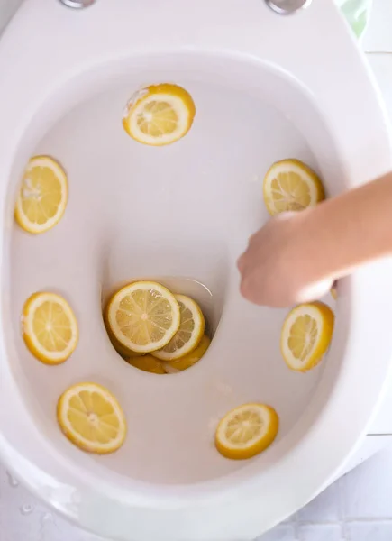 cleaning and refreshing toilets with citrus