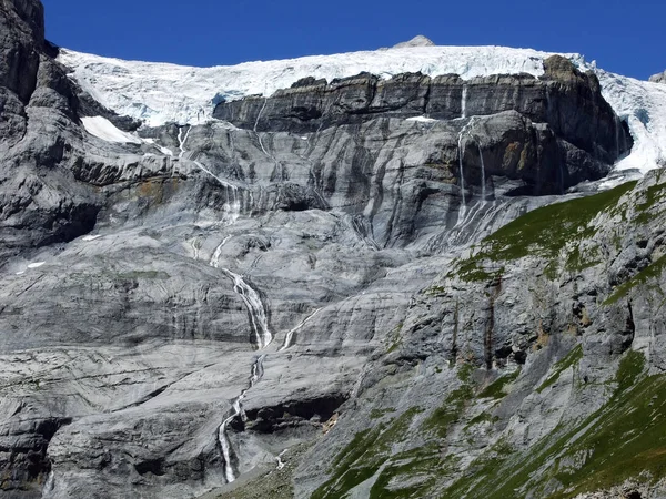 Seasonal glacier waterfalls Claridenfirn in the mountain range Glarus Alps - Canton of Glarus, Switzerland