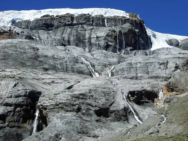 Seasonal glacier waterfalls Claridenfirn in the mountain range Glarus Alps - Canton of Glarus, Switzerland