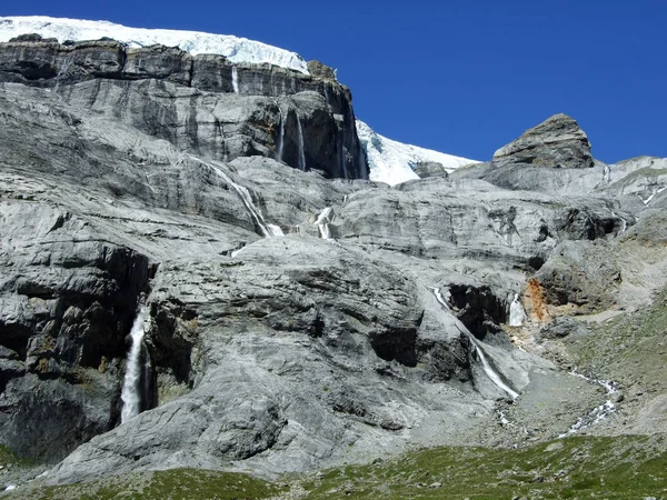 Seasonal glacier waterfalls Claridenfirn in the mountain range Glarus Alps - Canton of Glarus, Switzerland