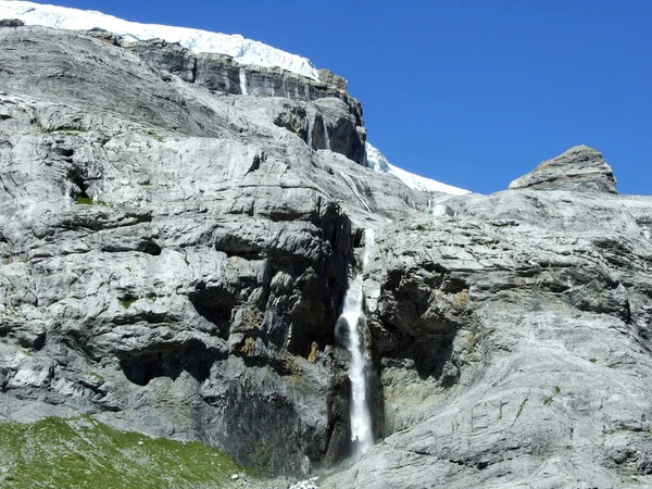 Seasonal glacier waterfalls Claridenfirn in the mountain range Glarus Alps - Canton of Glarus, Switzerland