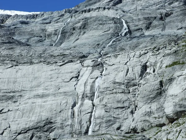 Seasonal glacier waterfalls Claridenfirn in the mountain range Glarus Alps - Canton of Glarus, Switzerland