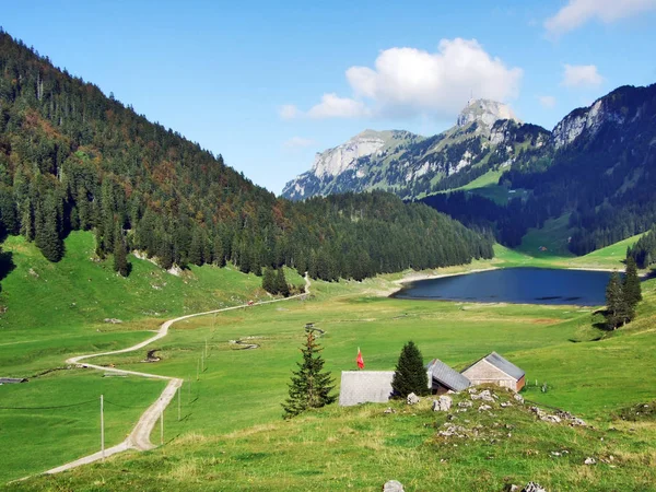 Alpine lake Seealpsee in mountain range Alpstein - Canton of Appenzell Innerrhoden, Switzerland