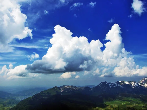 Spring clouds in the sky above the Churfirsten mountain range - Canton of St. Gallen, Switzerland