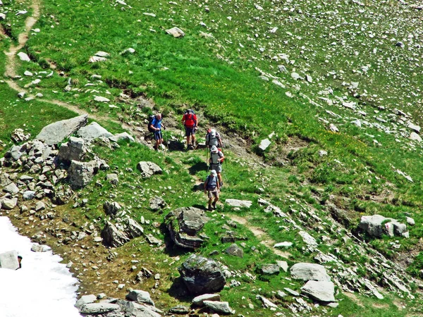Mountain hikers on the Alpstein mountain range - Cantons of St. Gallen and Appenzell, Switzerland