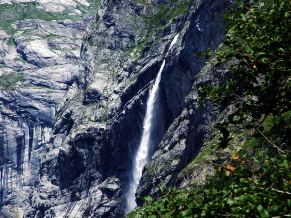 Source and waterfall Hufinquelle in the Alpine Valley of Maderanertal - Canton of Uri, Switzerland