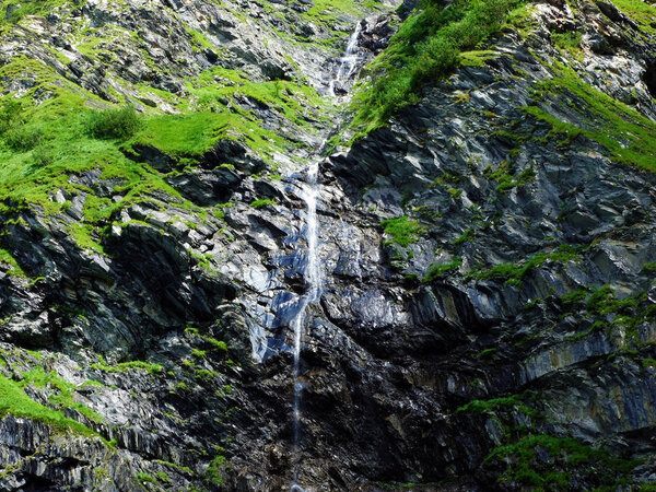 Seasonal waterfalls on the tributaries of the Jetzbach stream and in the alpine valley of Im Loch - Canton of Glarus, Switzerland