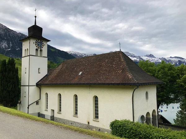 Parish church St. Catherine or St. Katharina in Innerthal village on alpine Lake Wagitalersee (Waegitalersee), Innerthal - Canton of Schwyz, Switzerland