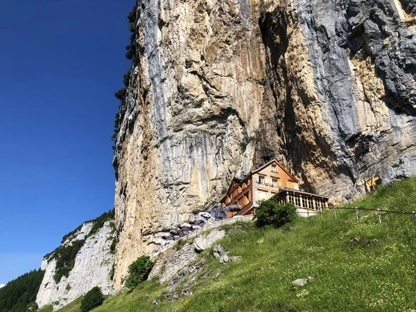 Landscape of the mountain Ebenalp and the mountain restaurant under the Ascher cliff in the Appenzellerland region - Canton of Appenzell (AI), Switzerland