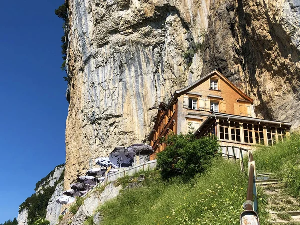 Landscape of the mountain Ebenalp and the mountain restaurant under the Ascher cliff in the Appenzellerland region - Canton of Appenzell (AI), Switzerland