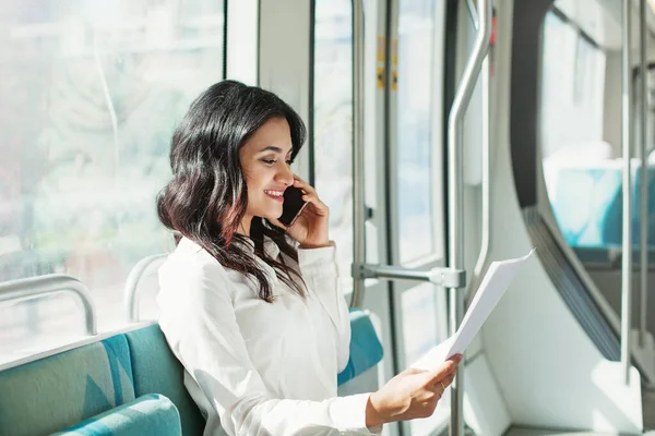 Young Indian Businesswoman Reading Documents Talking Phone Dubai Tram — Stock Photo, Image