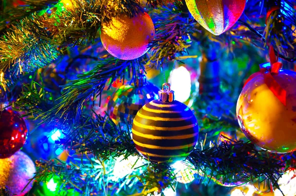 Christmas decorations hang on the Christmas tree — Stock Photo, Image