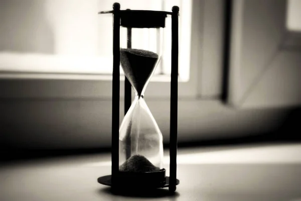 Hourglass Black Background Faded Light — Stock Photo, Image