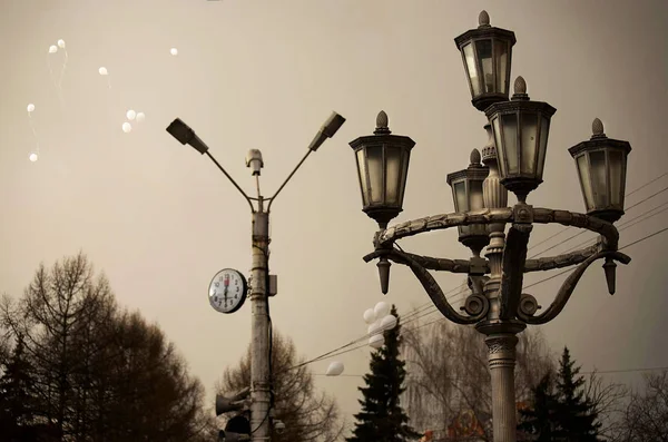old street lamp in the park in not very bright light