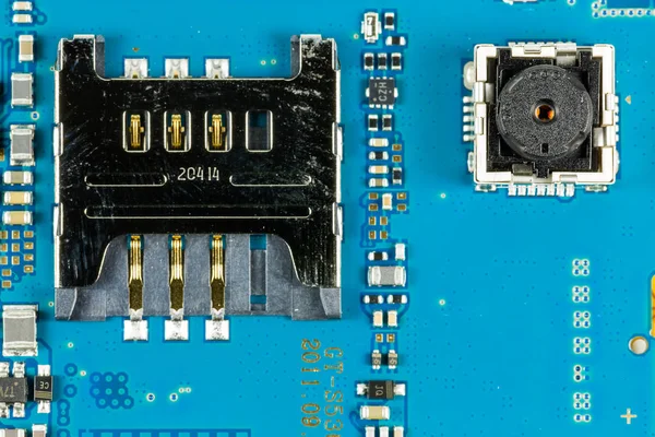 blue smartphone circuit board showing camera and sim card slot