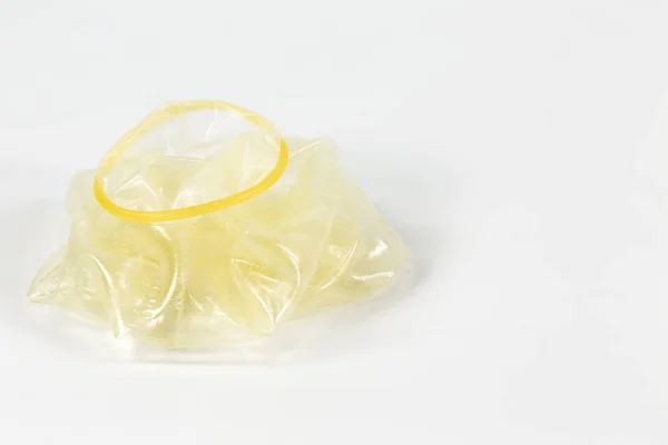 A rolled-off condom on the left isolated on white background — Stock Image Rolled Condom Left Isolated White Background Royalty Free Stock Photos