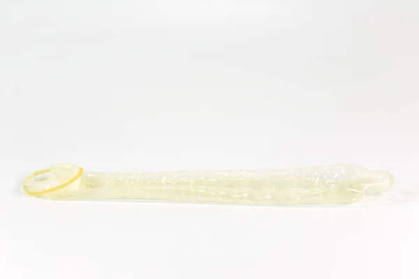 A rolled-off condom on the left isolated on white background — Stock Image Rolled Condom Left Isolated White Background Stock Image