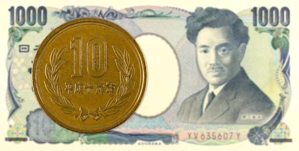 10 japanese yen coin against 1000 japanese yen bank note obverse