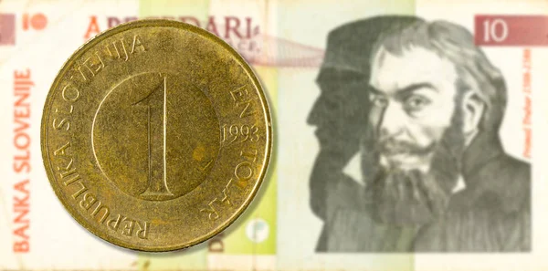 1斯洛文尼亚终端硬币反对10斯洛文尼亚终端银行笔记正面 — 图库照片
