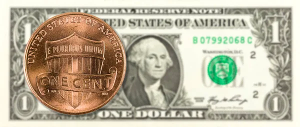 1美分硬币反对1美元银行纸币正面 — 图库照片