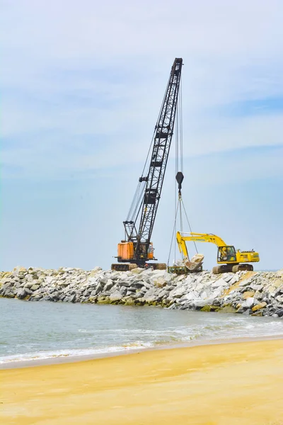 Udupi, India - NOVEMBER 11 2017: Industrial crane working in the coastal area