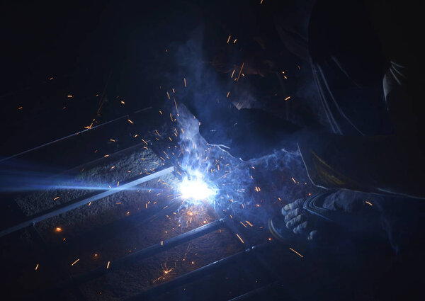 Sparks of bonding in a Welding shop