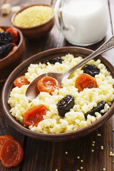 Millet porridge with dried fruits — Stock Photo, Image