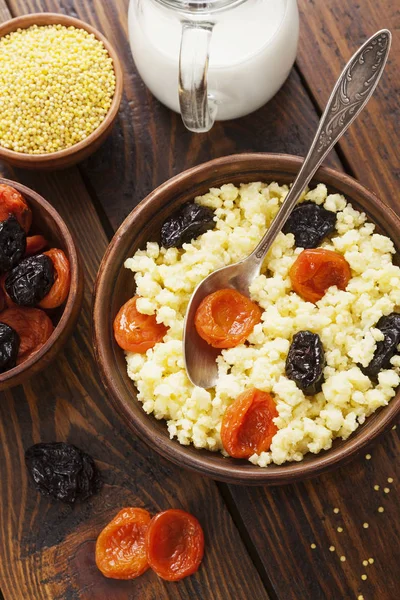 Millet porridge with dried fruits — Stock Photo, Image