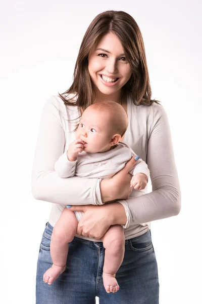 Happy mother with newborn daughter on hands — Stock Photo, Image