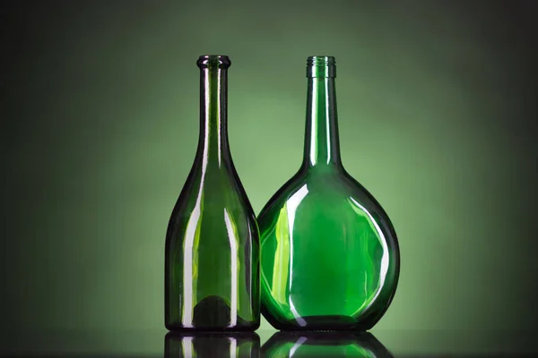 green bottles on a green background