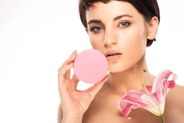 Beautiful brunette with short hair uses facial skin care products — Stock Photo, Image