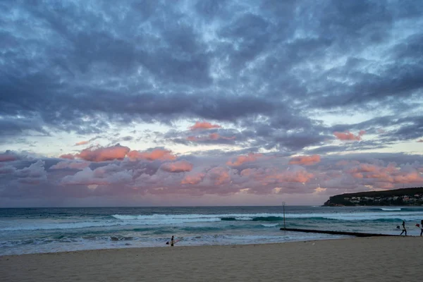 Beautiful sunset at the beach pink and blue colors